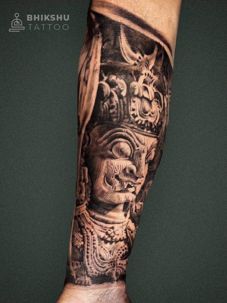 Detailed black and grey sculpture-style tattoo by Bhikshu Tattoo Studio